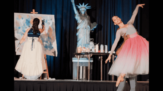 Woman painting and another woman posing as a ballerina